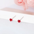 Detailed macro view of red heart-shaped S925 sterling silver mini stud earrings - 3mm / Heart / Red