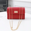 Red PU leather mini crossbody bag with golden chain strap and swivel lock closure - Red