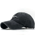 Vintage black washed cotton baseball cap featuring white rifle embroidery in 45-degree view - Adjustable / Washed AK-47 Black