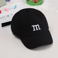 Kids black baseball cap featuring a minimalist white embroidered M letter - Adjustable / Black