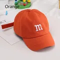 Kids' orange cotton baseball cap featuring a white embroidered letter m for sun protection - Adjustable / Orange