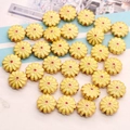 Detailed close-up of yellow enamel sunflower beads with golden trim for DIY jewelry - 12mm/Hole 2.0mm / Light Yellow