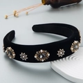 Baroque velvet headband with grey rhinestones and pearls on a white display stand - Black