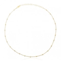 Collana minimalista in argento S925 con perline dorate disposta a cerchio su sfondo bianco - Oro