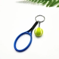Detail of mini tennis racket and ball keychain set with realistic mesh and texture - Blue