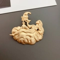 Detailed close-up of matte gold baroque brooch with female moon and stars motif - Angel Moon Brooch