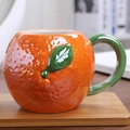 Creative orange shaped ceramic mug with realistic texture and a green leaf handle - Orange Shape / Orange