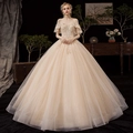 Elegant champagne gold off-shoulder bridal gown with sequins and shimmering tulle skirt - Champagne Floor-Length