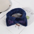 Dark blue plush bow headband with pink OMG embroidery for washing face and makeup - Navy Blue