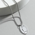 Polished stainless steel chain necklace with an oval football pendant on grey background - Silver