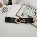 Elastic black waist belt with interlocking gold oval buckle on a minimalist white surface - Black