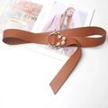 Detail of brown leather belt featuring a gold circular buckle with pearl embellishments - Camel