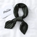 Detail of dark green pleated silk scarf showing elegant folds and satin texture - Dark Army Green