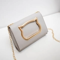 Light grey crossbody bag with golden cat ear metal detail and fine chain strap - Light Gray
