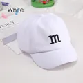 Toddler white cotton baseball cap featuring black embroidered letter M for sun protection - Adjustable / White