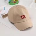 Kids khaki cotton baseball cap featuring a red embroidered M letter for sun protection - Adjustable / Khaki