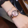 Close-up of rose gold watch and bracelet set featuring crystal swan design on wrist - Pink + Bracelet
