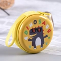 Yellow round tinplate coin purse with cartoon dinosaur and zipper closure - Letter Dinosaur No. 1 (Yellow)