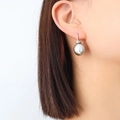 Elegant 18K gold plated titanium earrings featuring a lustrous grey pearl on a model - Steel Hook Pair / Steel Color Grey Pearl