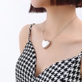 Elegant heart-shaped silver pendant necklace in titanium steel on a female model - Silver Color Large Heart Necklace