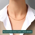 18K gold plated round snake chain necklace 1.3mm width shown on a female model - Snake Chain 40+5cm / Gold