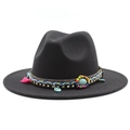 Close-up of black wool fedora featuring bohemian beads and turquoise ethnic detailing - Black