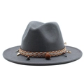 Detail of grey wool fedora hat with ethnic woven band, shells, and decorative pom-poms - M (56-58cm) / Dark Gray