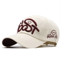 Detail shot of cream baseball cap featuring burgundy toast embroidery and side push me logo - Adjustable / Beige