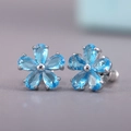 Elegant silver flower stud earrings featuring blue pear-cut zircon petals for women - Sky Blue