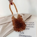 Handmade amber acrylic beaded evening bag with golden rings and cluster texture detail - Brown