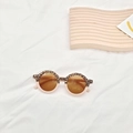 Detail of round leopard and pink kids' sunglasses with UV400 and CE marked lenses - Leopard Light Pink