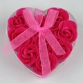 Close-up of nine pink soap roses in a heart-shaped gift box with a pink silk ribbon bow - Rose Red