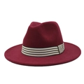 Close-up of wine red wool fedora hat with a striped grosgrain ribbon trim and wide flat brim - Burgundy