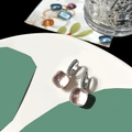 Macro shot of champagne square stone earrings with silver micro-paved diamond hoops - Clear White