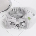 Gray coral fleece bow headband with black OMG embroidery for washing face and makeup - Gray