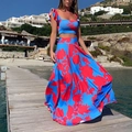 Detail of floral print summer set featuring blue crop top and high waist maxi skirt - S / Multicolor