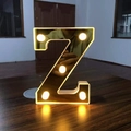 Golden mirror finish letter Z LED decorative light with warm glowing bulbs - Letter Z