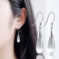 Close-up of teardrop catseye stone earrings on model showing silver hook details - Silver Teardrop Style (ED2652-2)