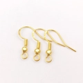 Macro shot of gold-plated S925 sterling silver earring hooks for DIY jewelry making - Gold Stamped 925 Ear Hook