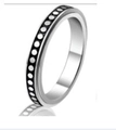 Modern stainless steel spinning ring featuring a black and white polka dot pattern design - US 6 / 4MM Dot Pattern