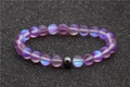 Iridescent purple moonstone beaded bracelet with black hematite accent on glittery background - Purple Moonstone Hematite