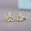 Elegant flower stud earrings with yellow cubic zirconia petals and silver finish - Yellow