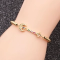 Adjustable gold star and moon bracelet with multicolored zircon stones on wrist - Bead Chain Moon Star / Gold