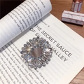Macro shot of sparkling crystal wreath phone ring holder on a vintage book surface - Gem Holder-No.4 Square-Silver Base