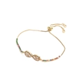Dettaglio del bracciale infinito dorato con zirconi e chiusura a coulisse regolabile - Infinito Con Zirconia Rettangolare Chiara e Rotonda Colorata / Infinito A