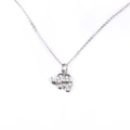 Macro view of silver elephant pendant with micro-set zircon stones on white background - Platinum Elephant Necklace