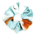 Close-up of soft fabric scrunchie with light blue and orange tie-dye gradient texture - Light Blue