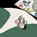 Macro detail of square cut pink crystal earrings with pavé set zircon stones on silver loops - White Jade