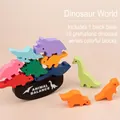 Wooden dinosaur balance blocks set with black base and ten colorful prehistoric animal figures - Dinosaur World