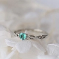 Elegant white gold plated heart ring featuring a green emerald and twisted diamond band - US 6 / Platinum Plated Green Zirconia
